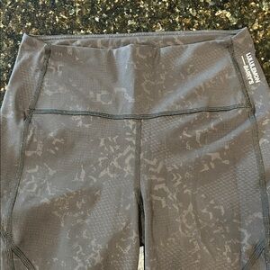 Lululemon Stronger As One Collection Black and Gray Leggings w Pockets